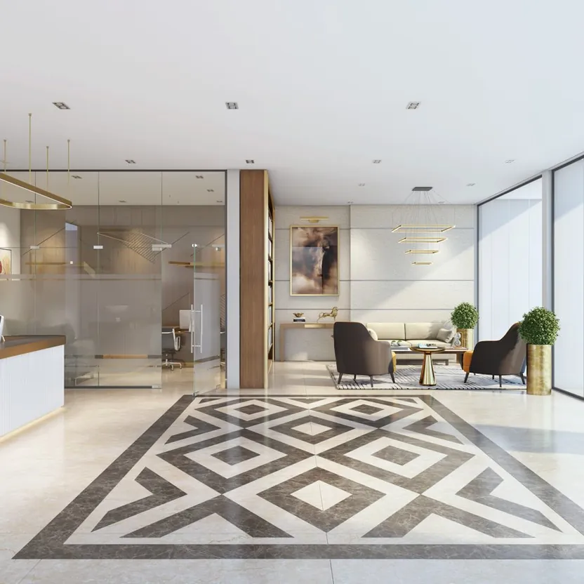 A bright entrance lobby with a patterned stone floor and a reception desk at ELV HighGarden