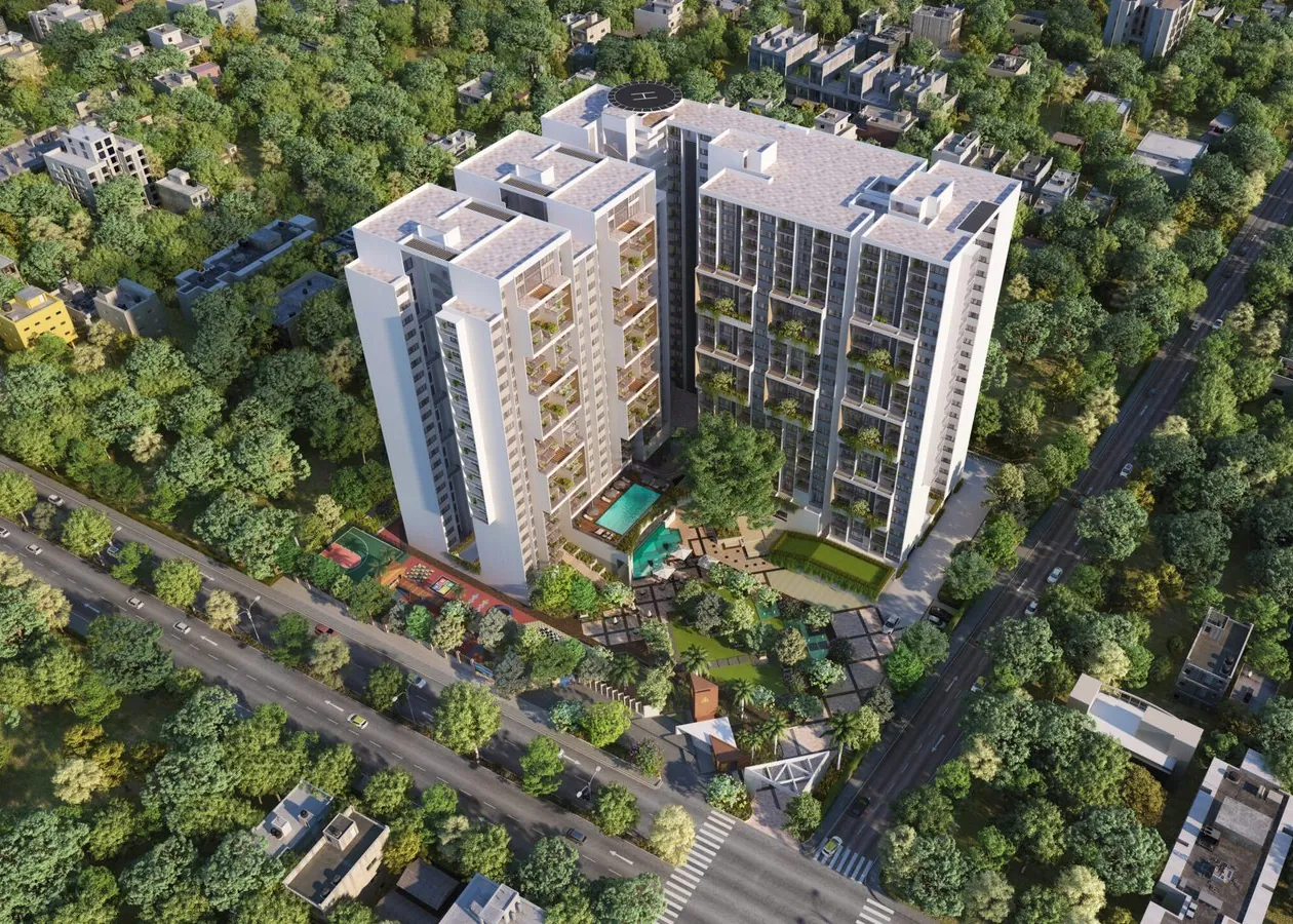 Two white apartment towers with planted balconies rising above a canopy of trees at ELV HighGarden