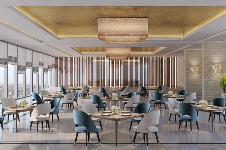 A banquet hall set with dining tables under a gold ceiling